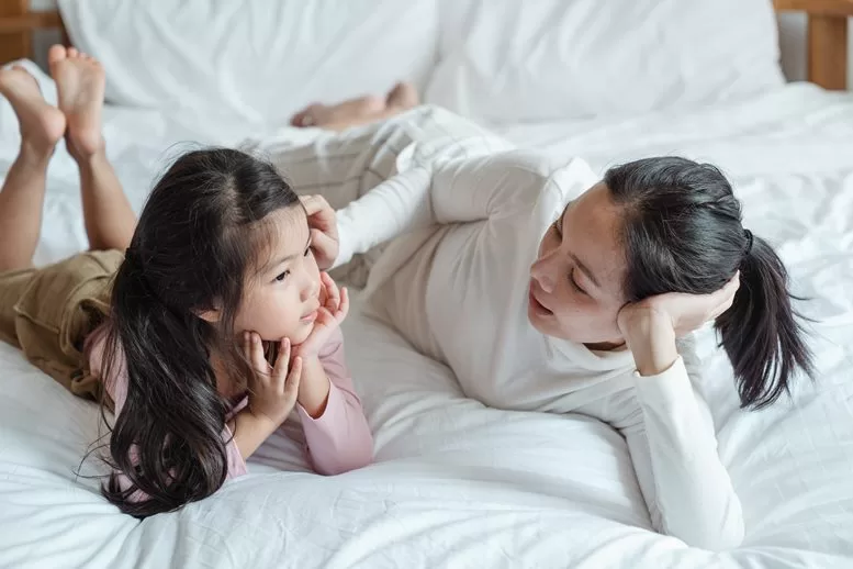 mother talking to daughter on bed - ketut subiyanto for pexels.com