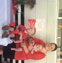 mother and 2 boys in red
