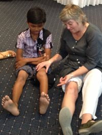 Cambodia NZ physio with patient