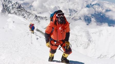 Chris taking the final steps to the summit of Mt Everest