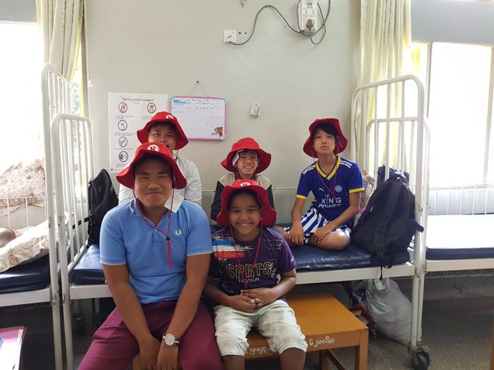 Children on a hospital bed in Myanmar