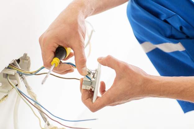 electrician repairing a switch