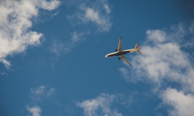 plane in clouds - Photo by Brett Sayles from Pexels