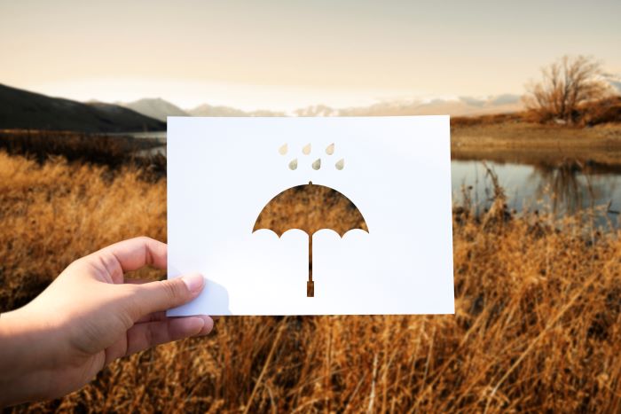 umbrella on cut-out card - rawpixel.com-for-freepik