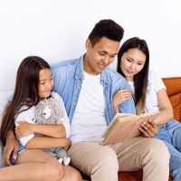 father reading to two daughters - photo by antoni shkraba for Pexels.com