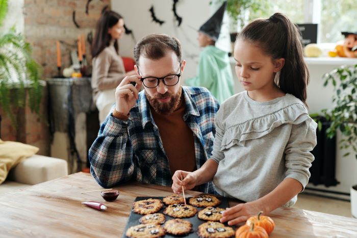 father and preteen daughter baking cookies - photo by Daisy Anderson for Pexels.com