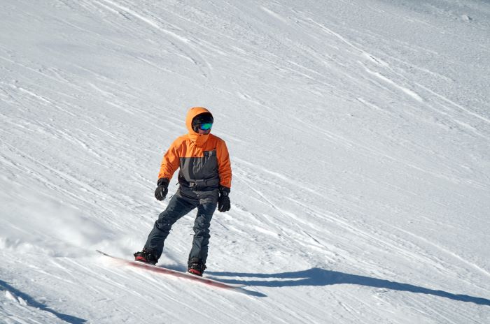 man snowboarding - photo by valentine kulikov for Pexels.com